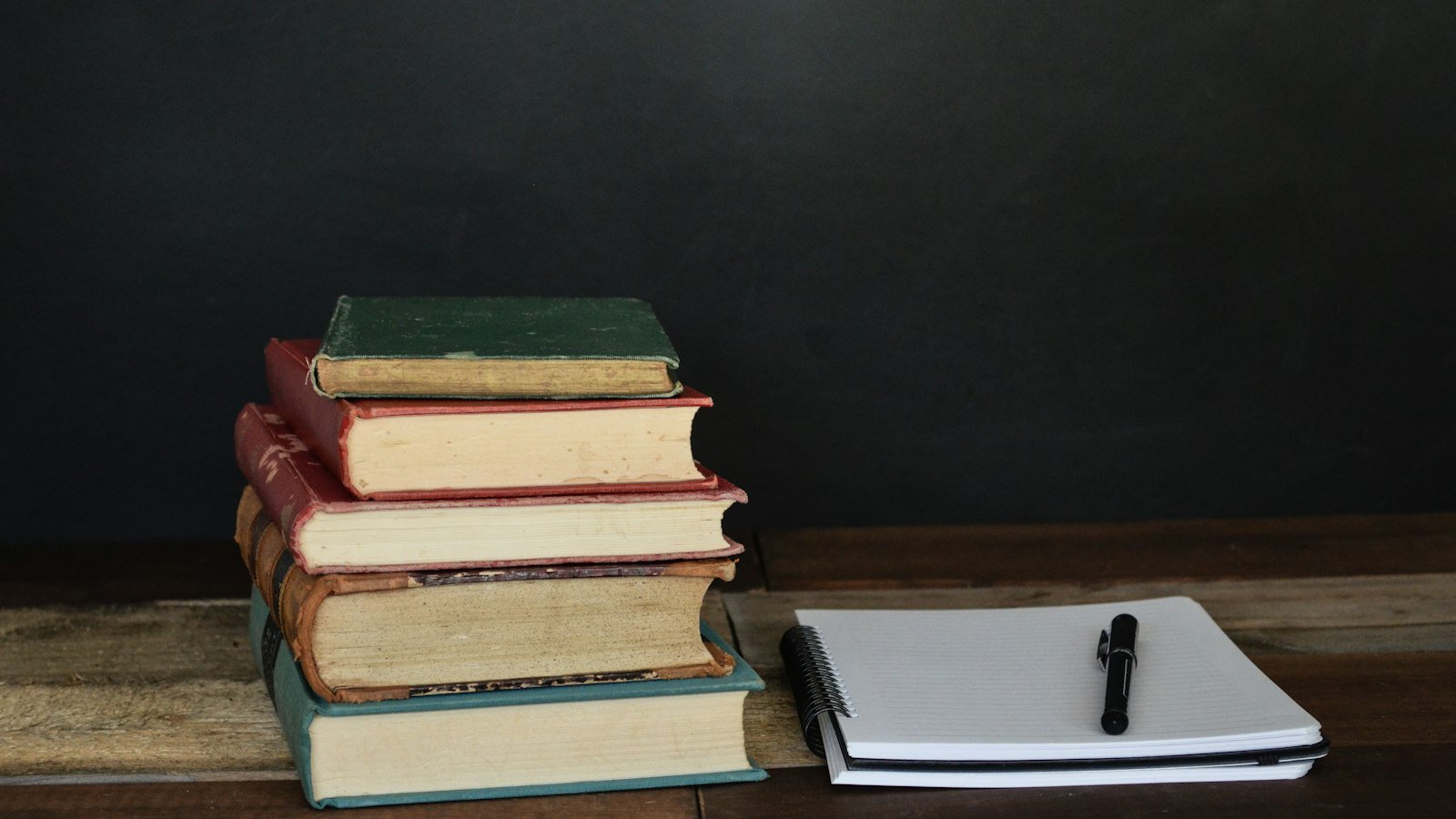 A stack of books on a desk, representing content marketing