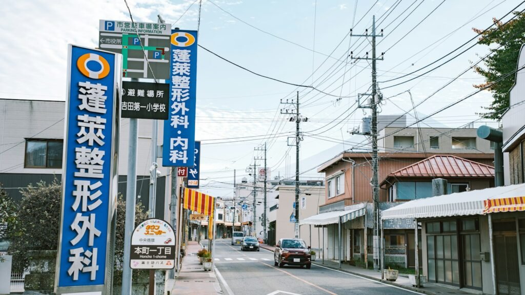 Clinic signboard above a shopfront on a city street