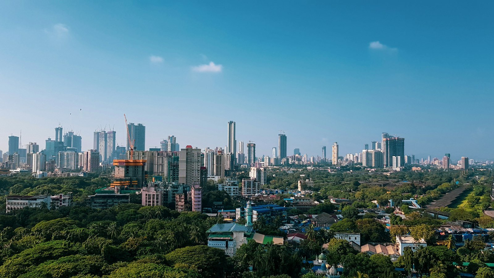High-rise buildings in a city skyline, representing hospital growth strategy