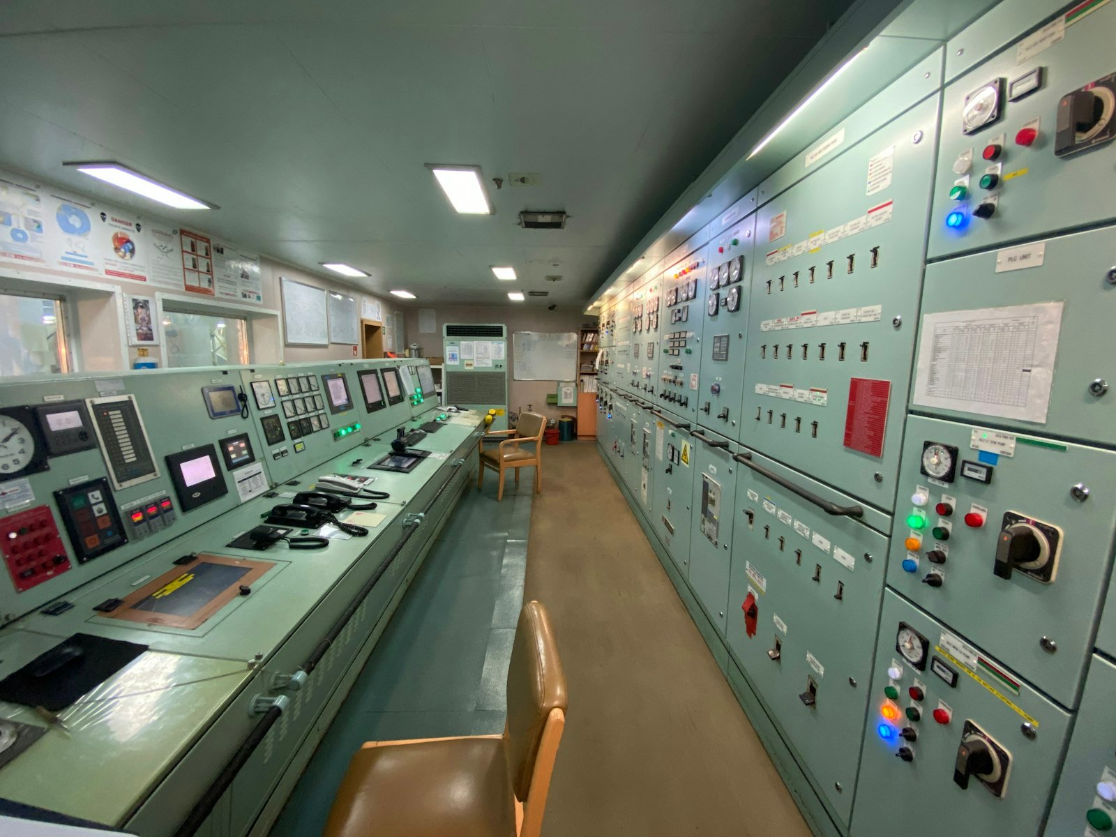 Empty control room with a bank of monitor screens