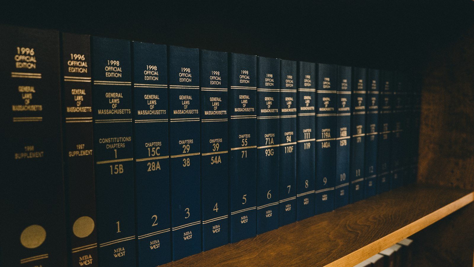 Law books on library shelves, representing advertising rules