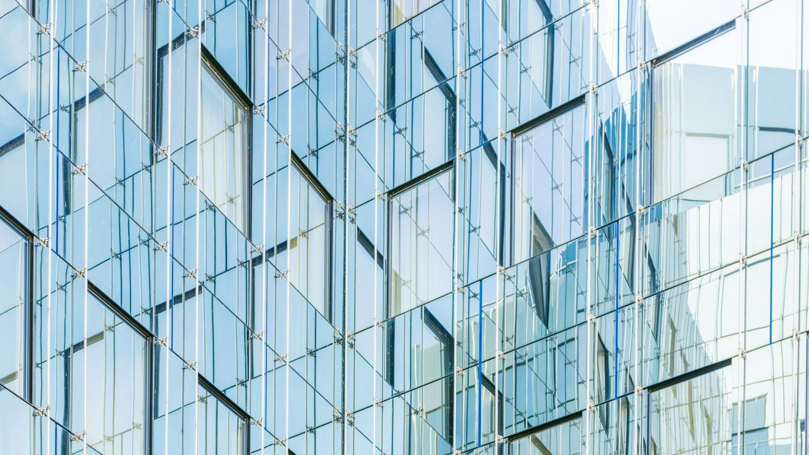 Glass facade of a modern building against a clear sky