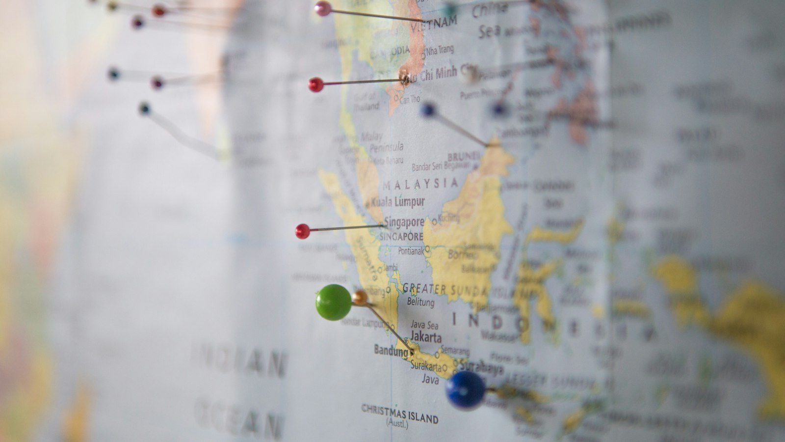 Paper city map with coloured pins marking locations