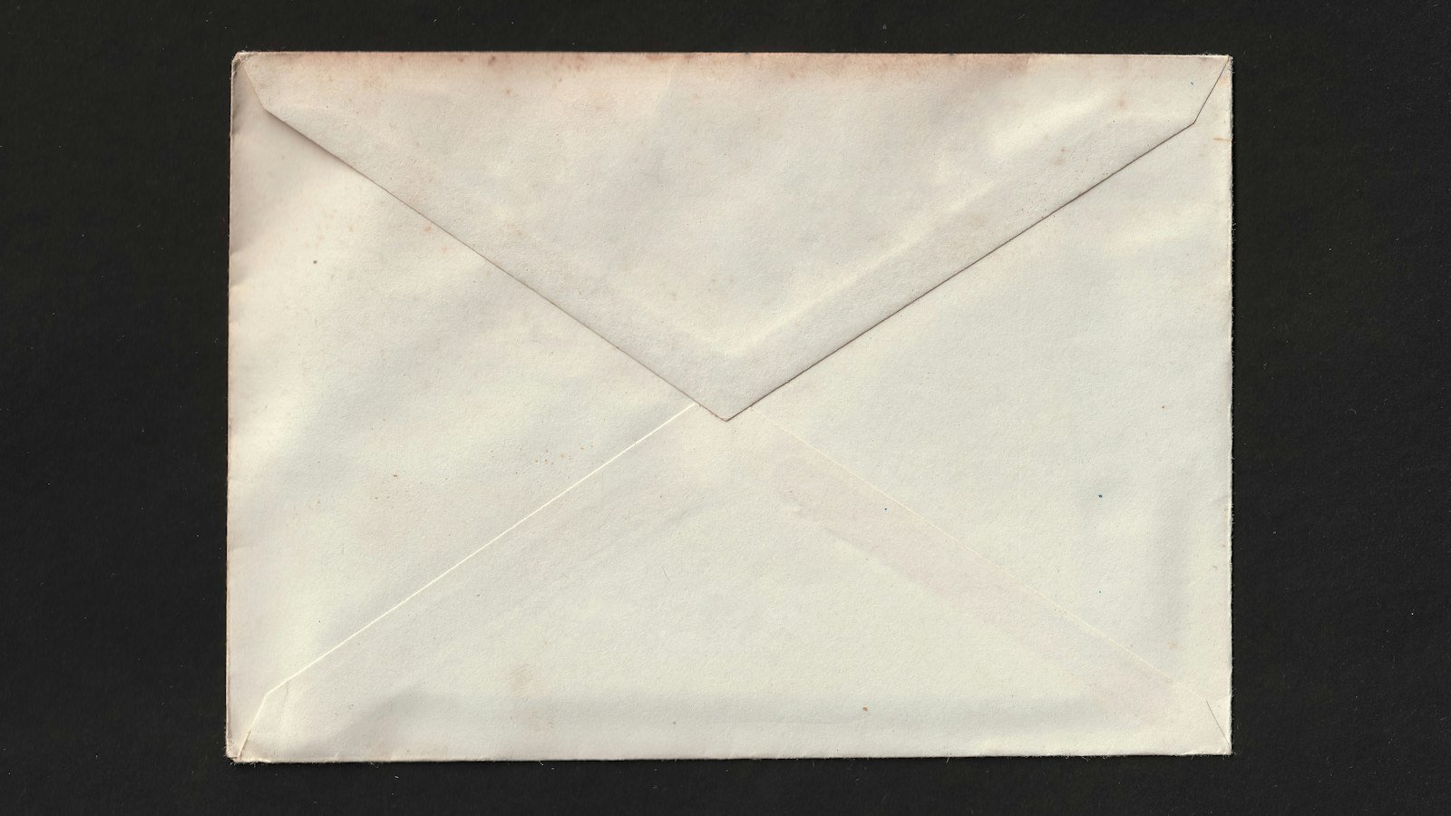 A white envelope on a black background