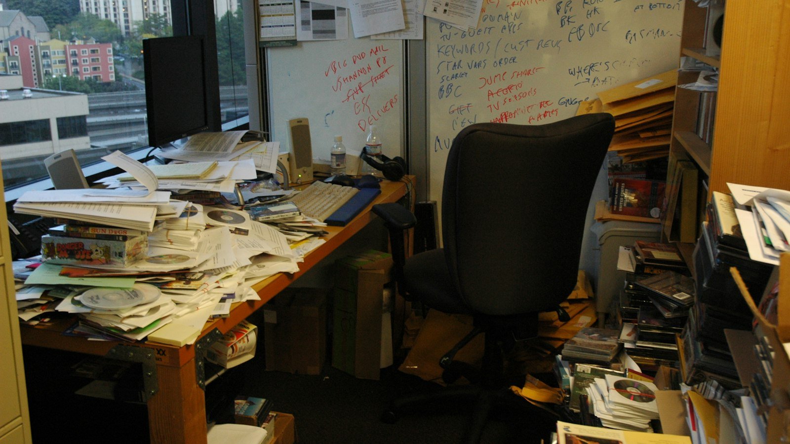 A stack of folded newspapers on a desk
