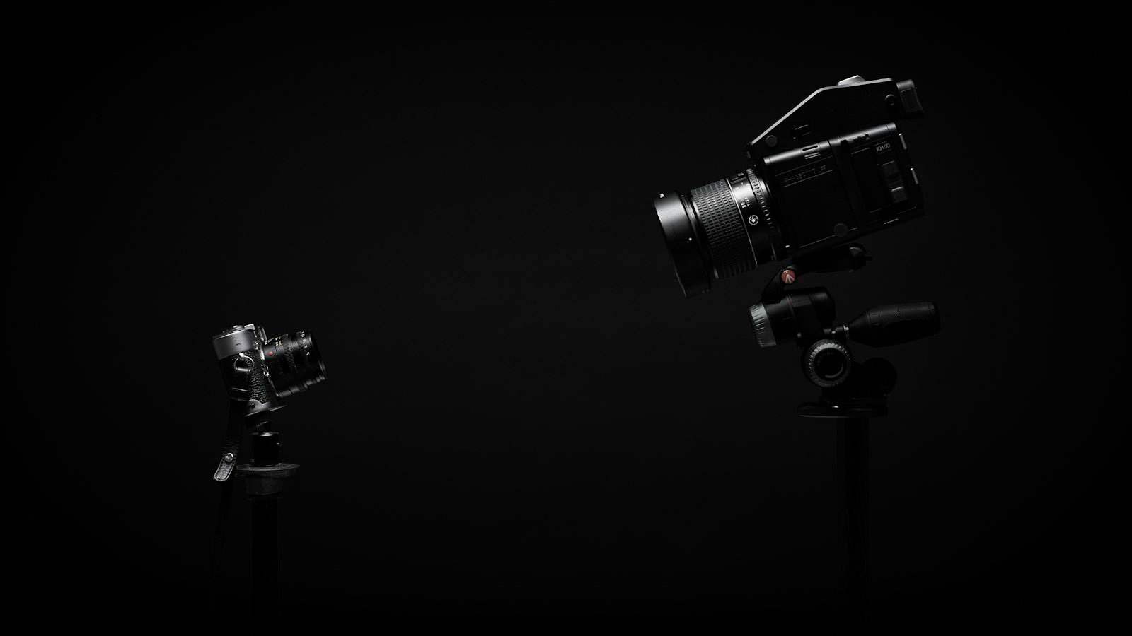 Camera, microphone and a softbox light arranged for a small video shoot