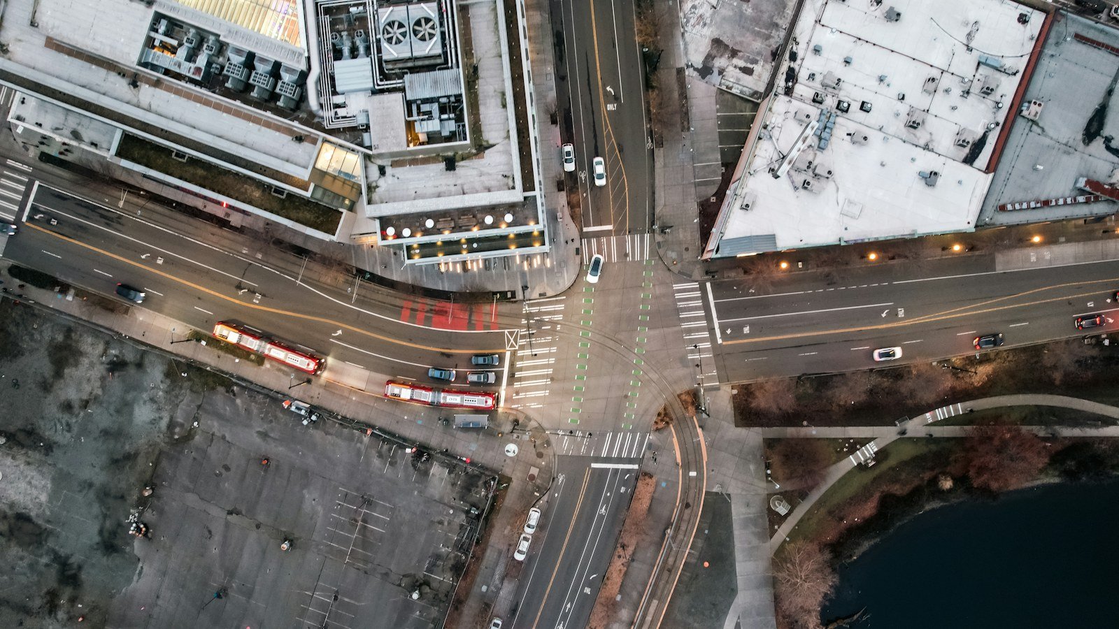 Aerial view of a city crossroads with buildings and traffic