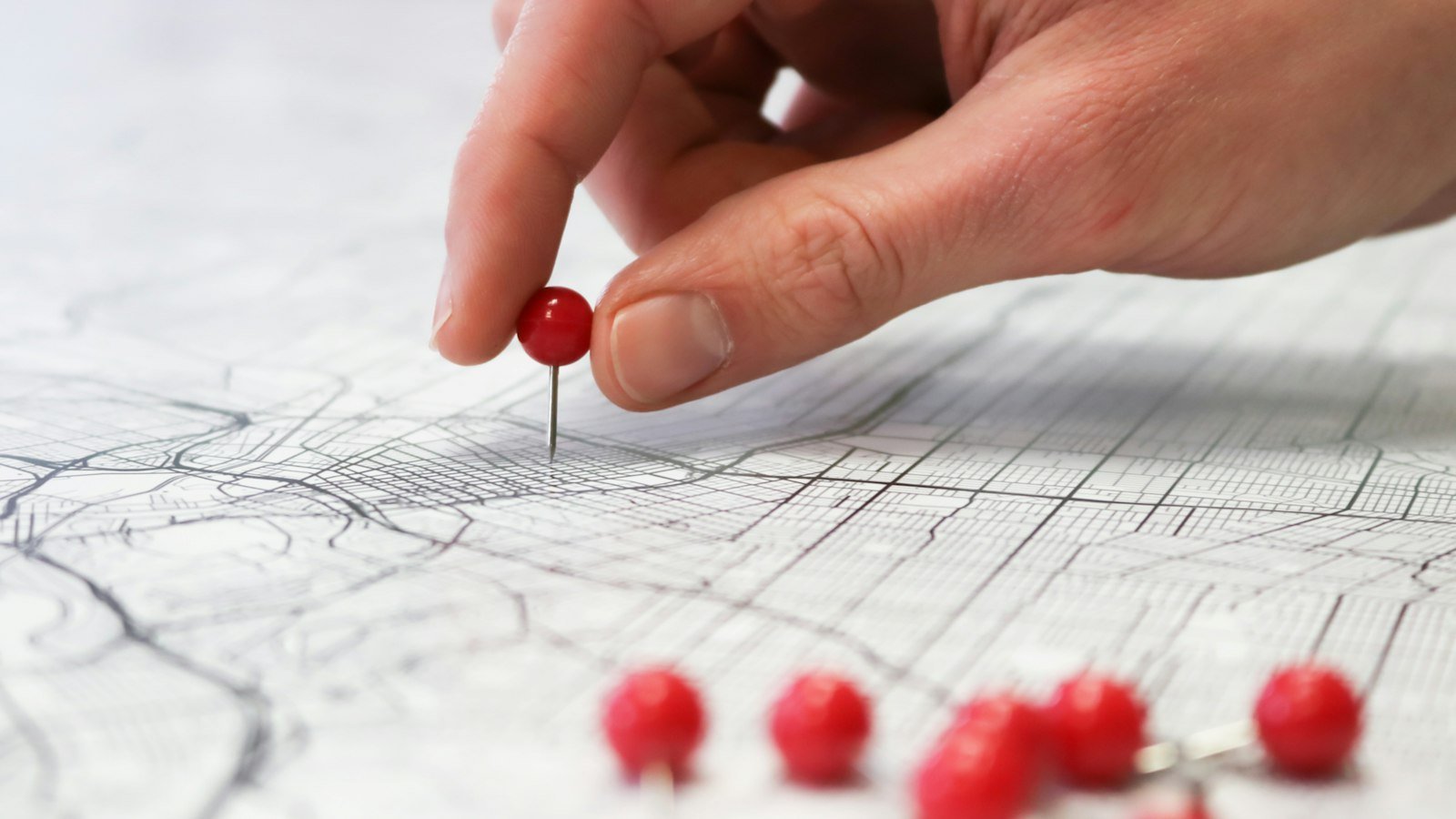 A map with pins marking a route, representing the patient journey