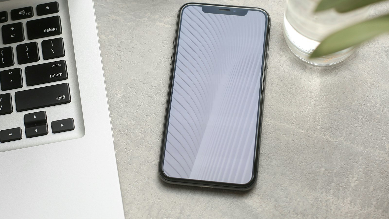 A smartphone on a desk, representing WhatsApp messaging for hospitals