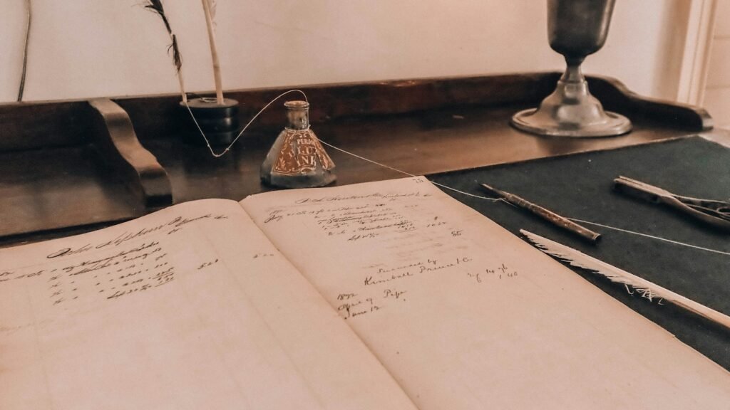 A stethoscope resting on an open reference book on a wooden desk