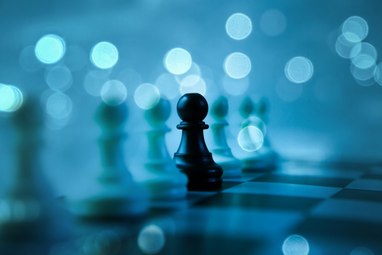 A black pawn standing out on a chessboard, illustrating the decisions a CMO makes about AI