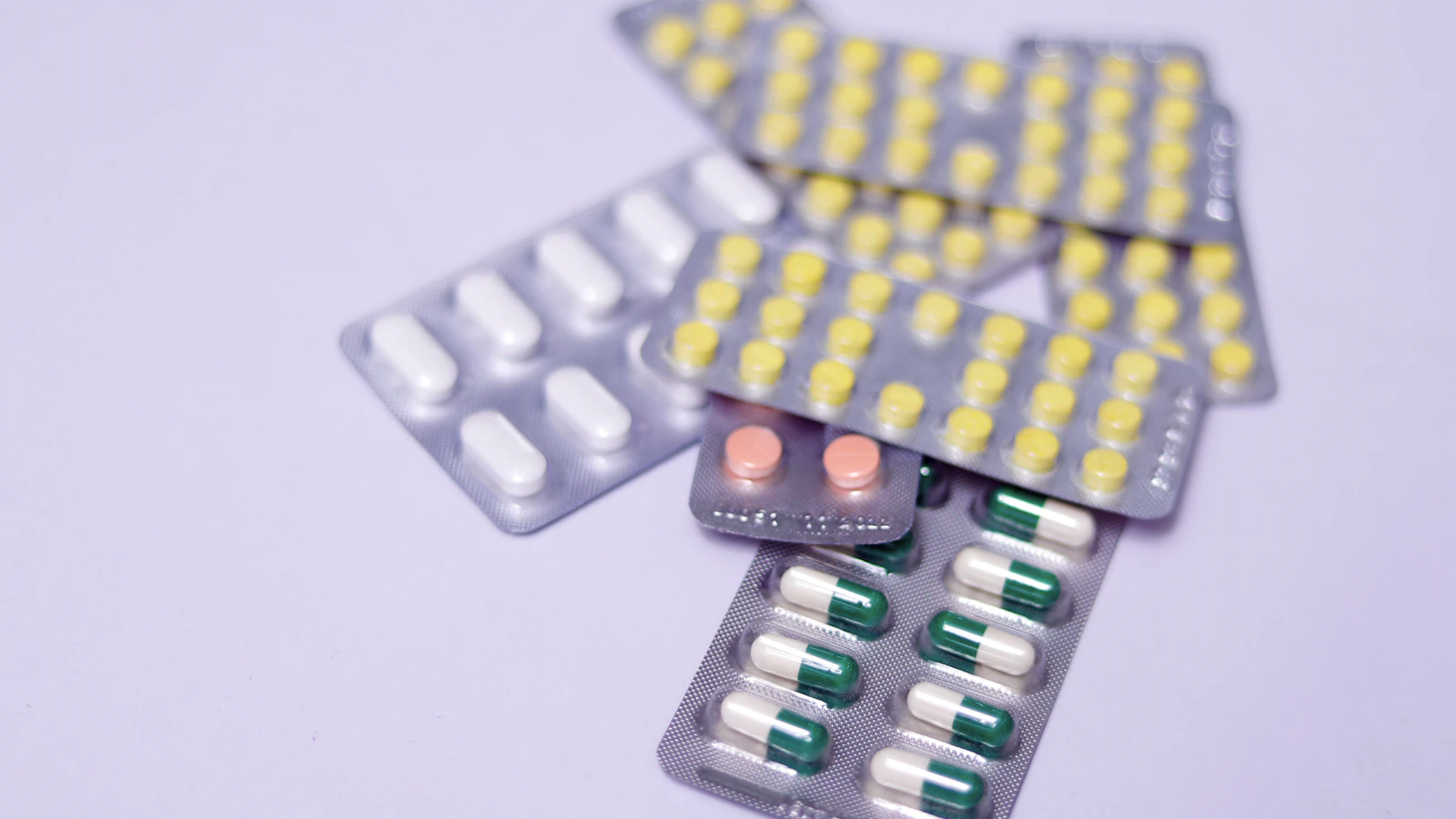 Tablet strips stacked on a white surface