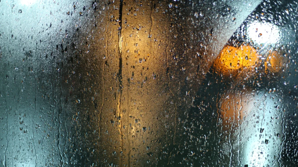 Rain drops on a window during the monsoon