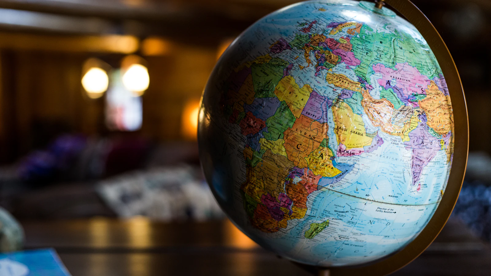 A desk globe on a wooden table