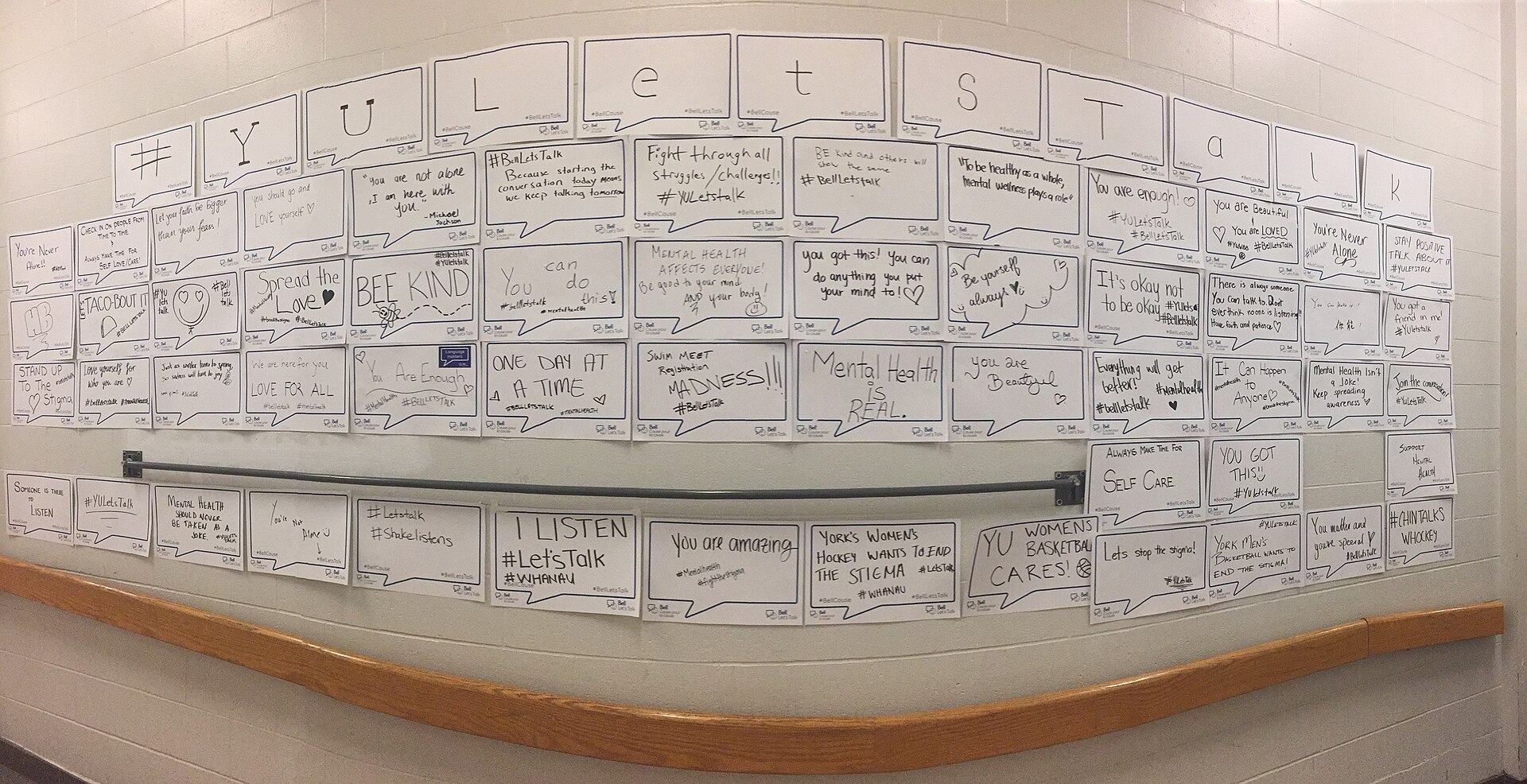 Wall of speech bubble notes at York University in Toronto promoting Bell Let's Talk