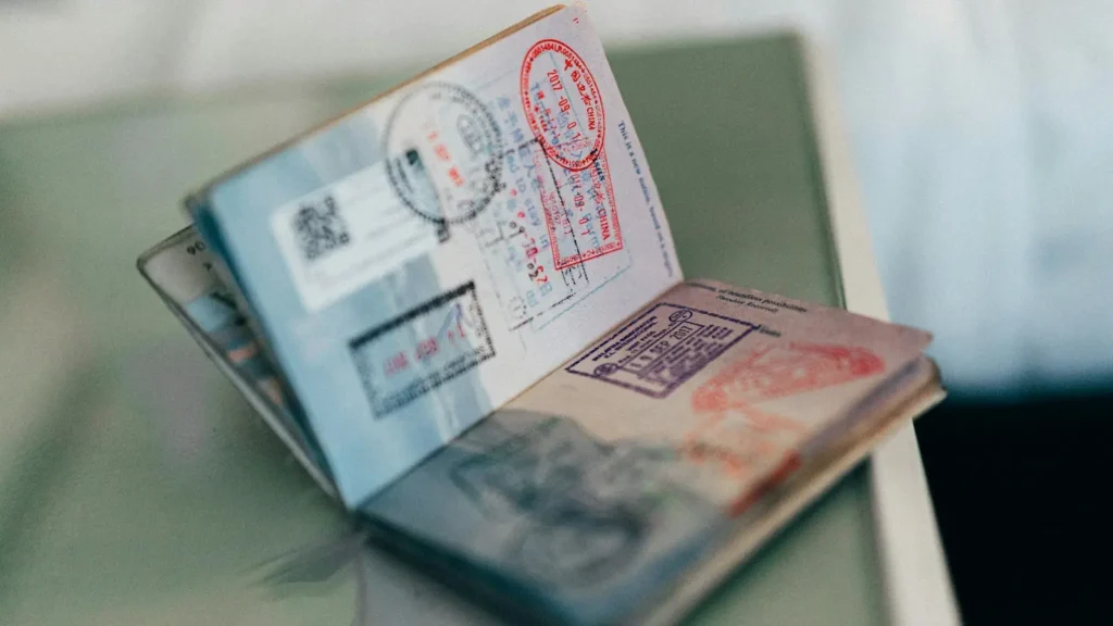 An open passport showing colourful entry and exit ink stamps