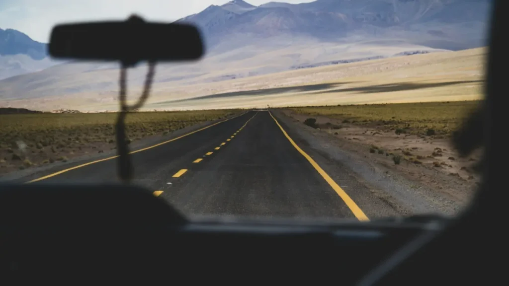 View through a car windscreen of an empty open highway